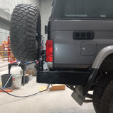 MCC REAR WHEEL CARRIER BAR WITH DUAL JERRY CAN HOLDERS FOR TOYOTA LAND CRUISER 84-07