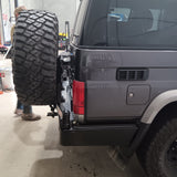 MCC REAR WHEEL CARRIER BAR WITH DUAL JERRY CAN HOLDERS FOR TOYOTA LAND CRUISER 84-07