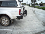 MCC REAR WHEEL CARRIER BAR WITH DUAL JERRY CAN HOLDERS FOR NISSAN NAVARA 97-15