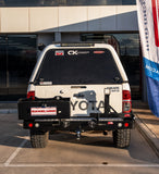 MCC REAR WHEEL CARRIER BAR WITH DUAL JERRY CAN HOLDERS FOR TOYOTA HILUX 15-ON